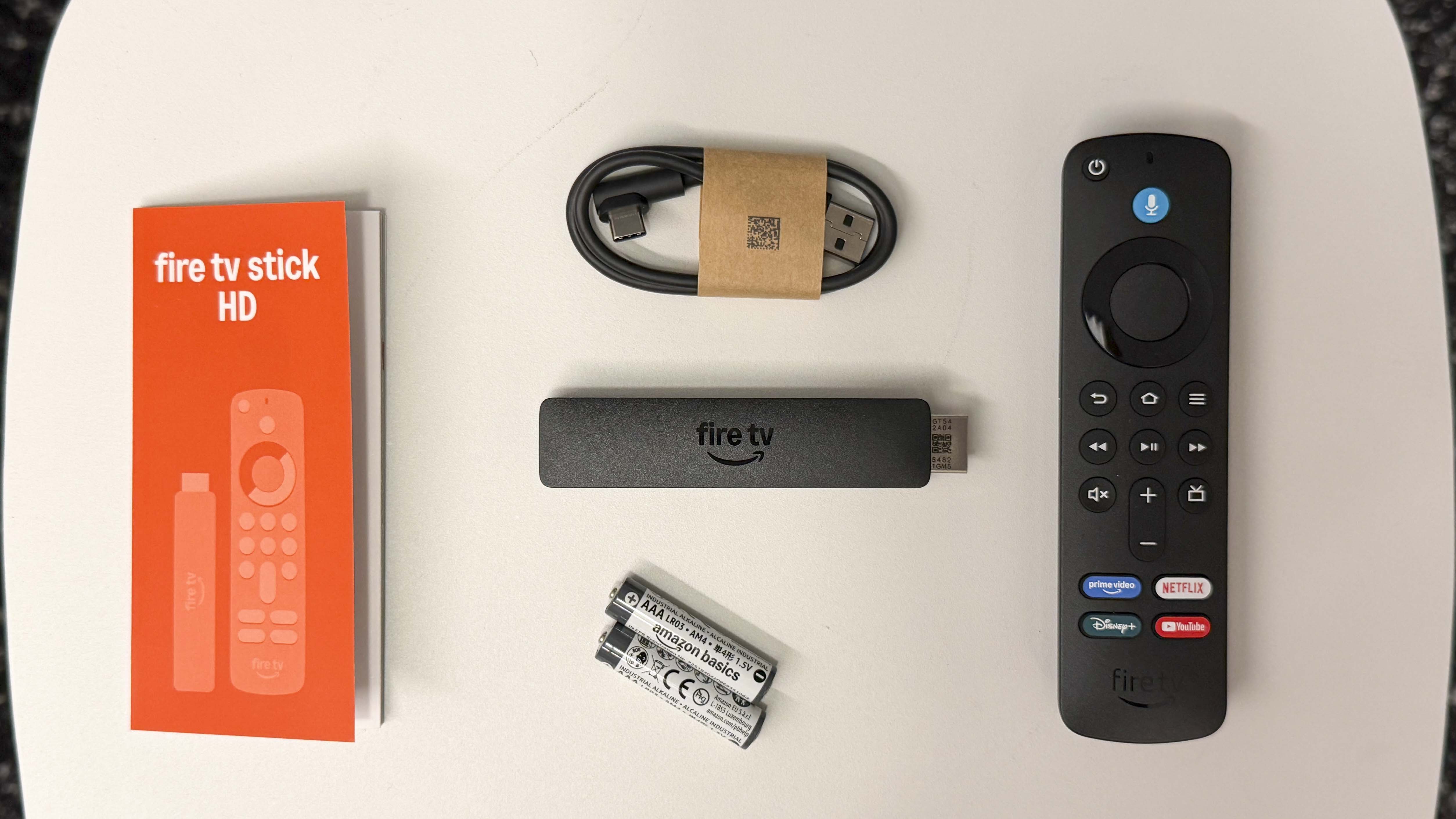 Fire TV Stick remote with streaming app grid